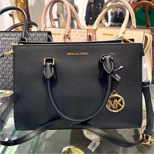 Michael Kors Sheila Medium Center Zip Satchel Bag
Color: Black